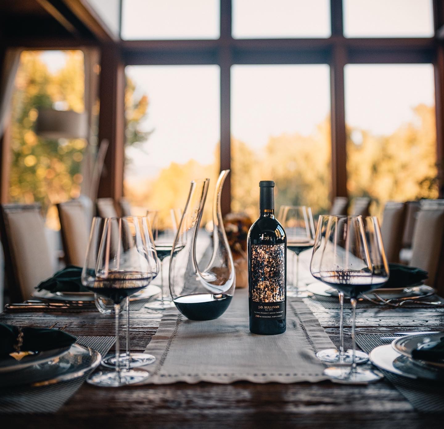 A bottle and of Ellman wine on the dinner table