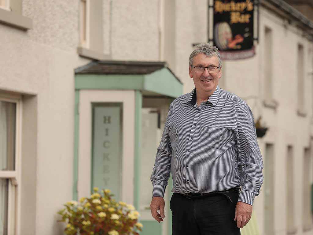Owner of Hickey's Bar, Silvermines outside his premises 