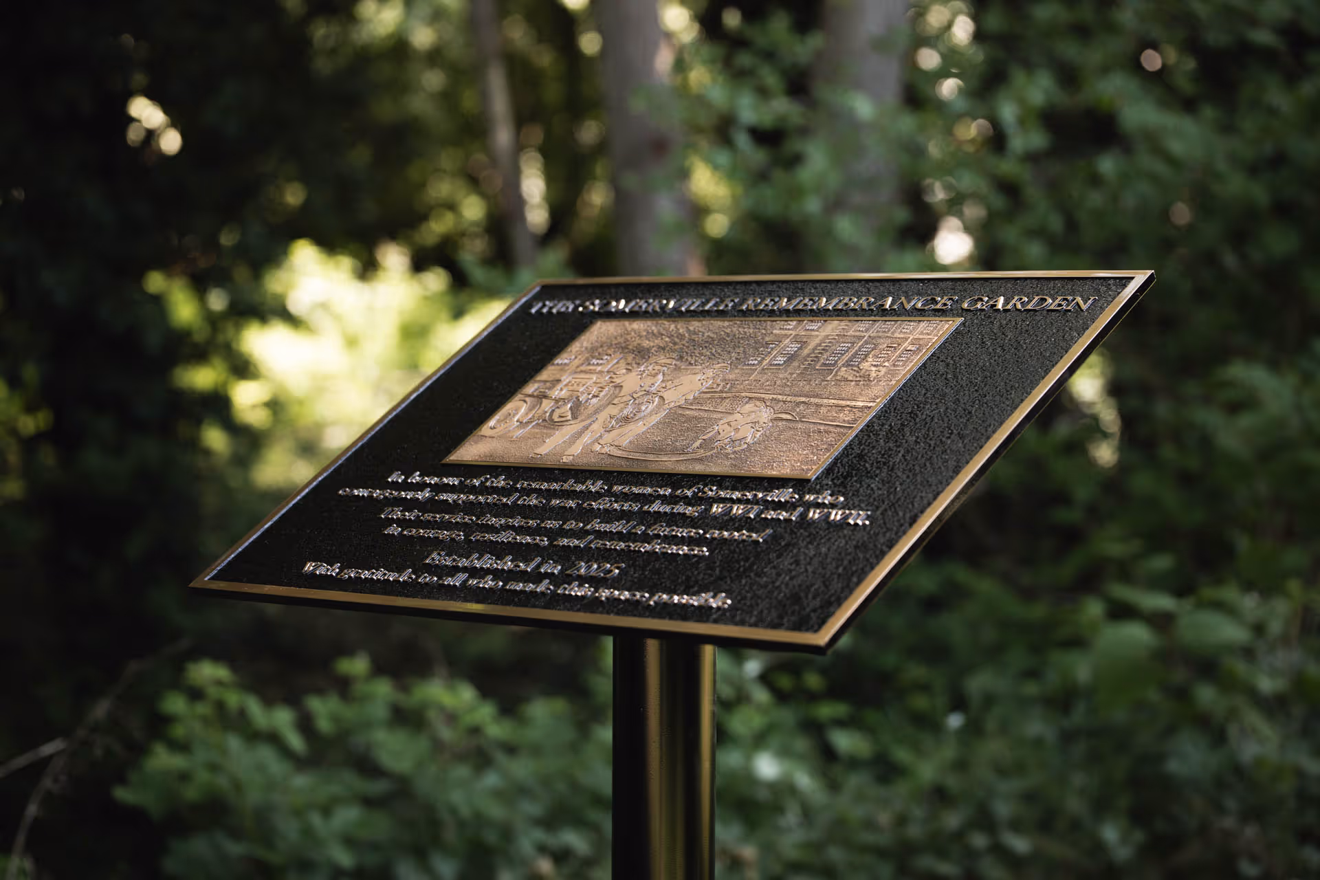 A commemorative bronze plaque for The Somerville Remembrance Garden in Oxford, dedicated to the remarkable women of Somerville College who supported the war efforts during both WWI and WWII.