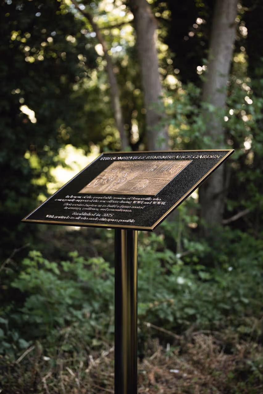 Cast bronze commemorative plaque at Somerville College’s Remembrance Garden, honouring the women of Somerville who supported the war efforts during WWI and WWII, established in 2025.