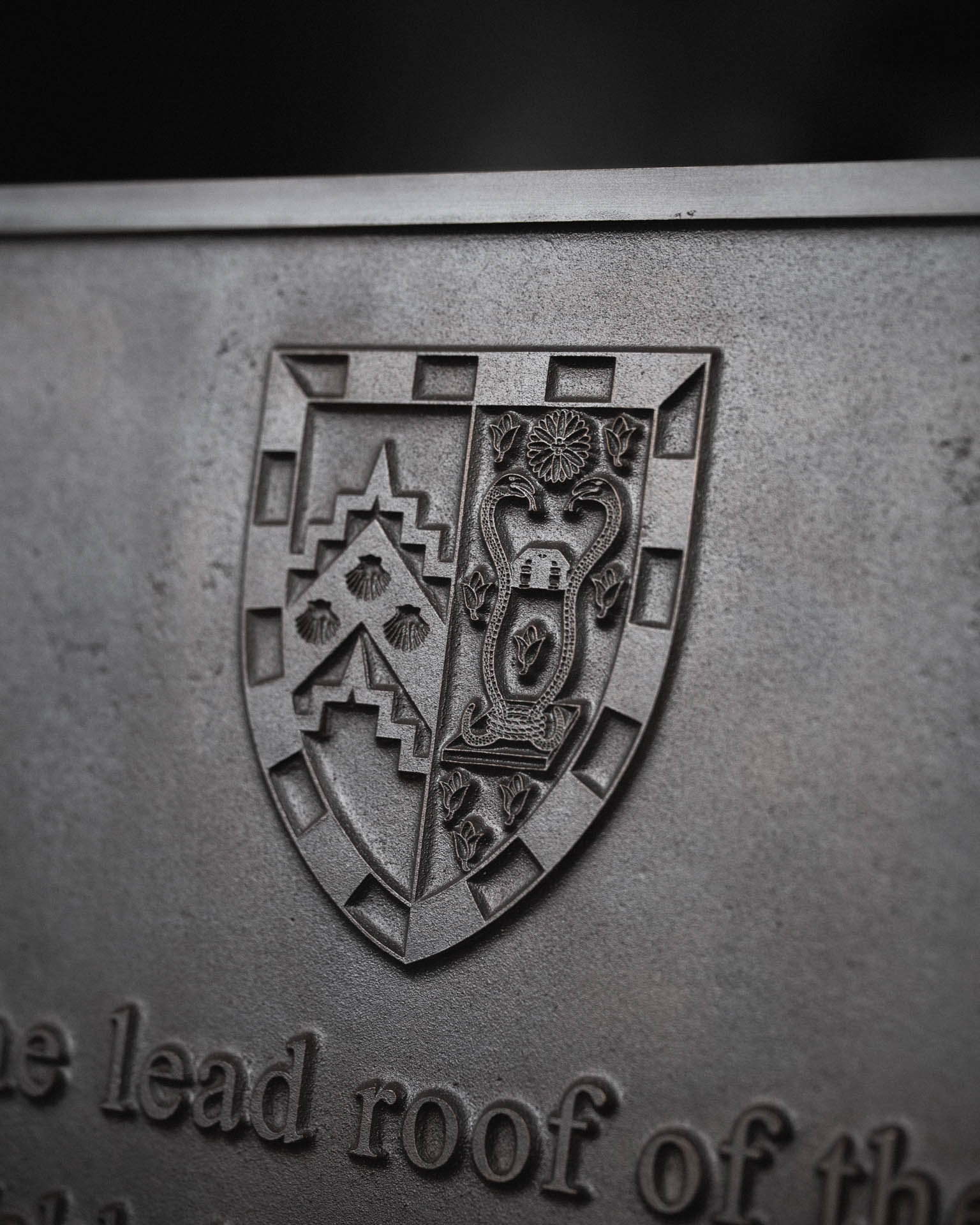 Cast bronze commemorative plaque marking the recasting of the lead roof of the Aston Webb building in 2025, featuring the crest and names of Norfolk Sheet Lead Ltd, Cocksedge Building Contractors, and Ward Booth Partnership.