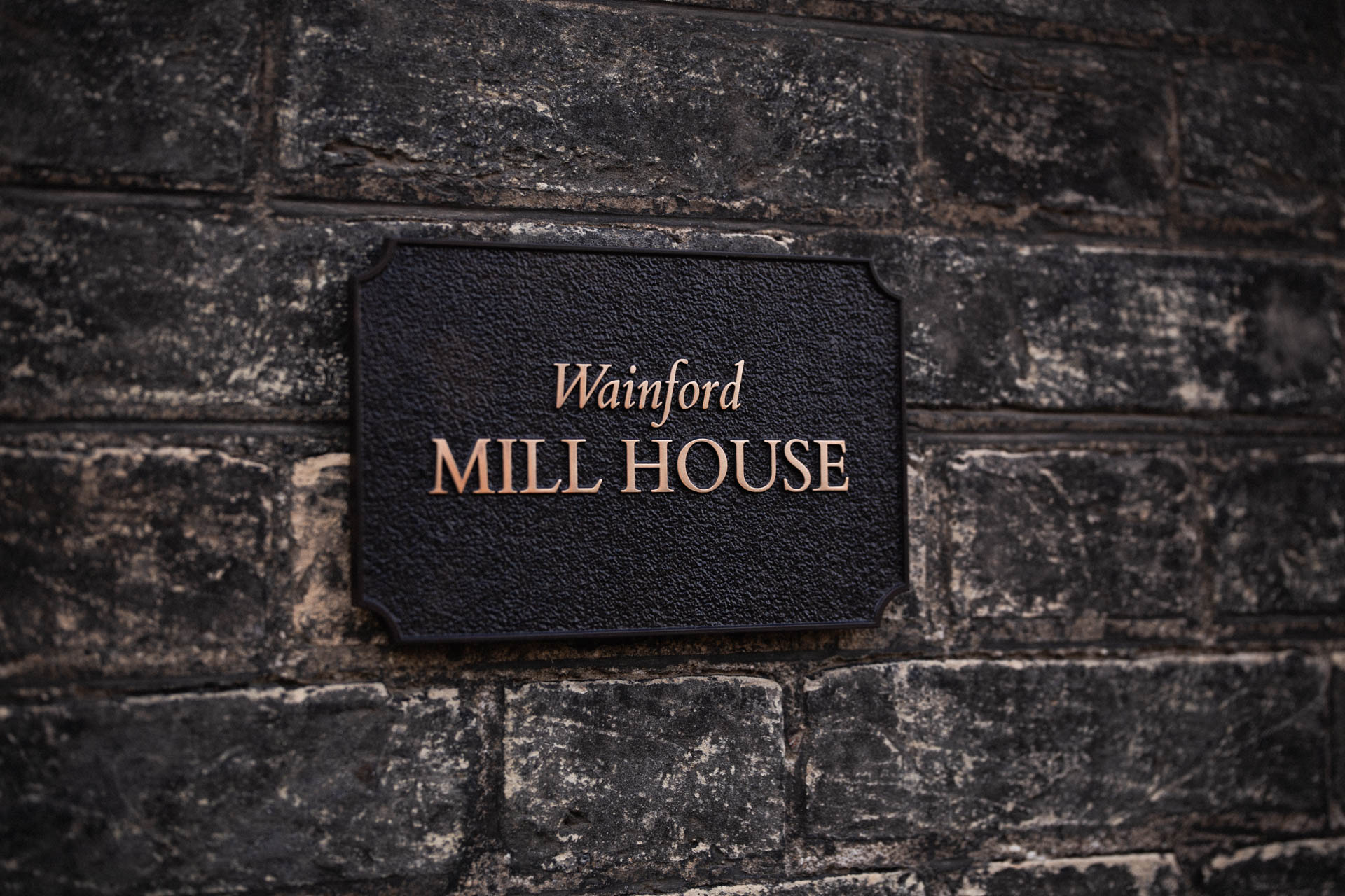 Elegant handcrafted house sign for Wainford Mill House, a charming Suffolk property. Expertly cast in metal for a timeless and refined look.