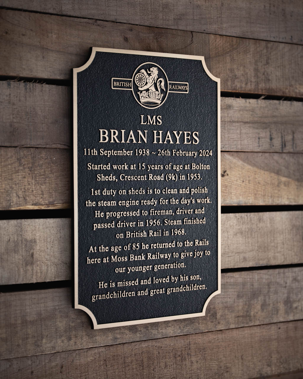 Beautiful cast bronze memorial plaque with a textured black background, featuring a custom ceramic cameo portrait for a personalised tribute. Designed with raised gold lettering, an integral ground stake for secure outdoor placement, and a durable weather-resistant finish. This bespoke memorial plaque offers a timeless way to honour a loved one, perfect for cemeteries, gardens, and remembrance spaces.