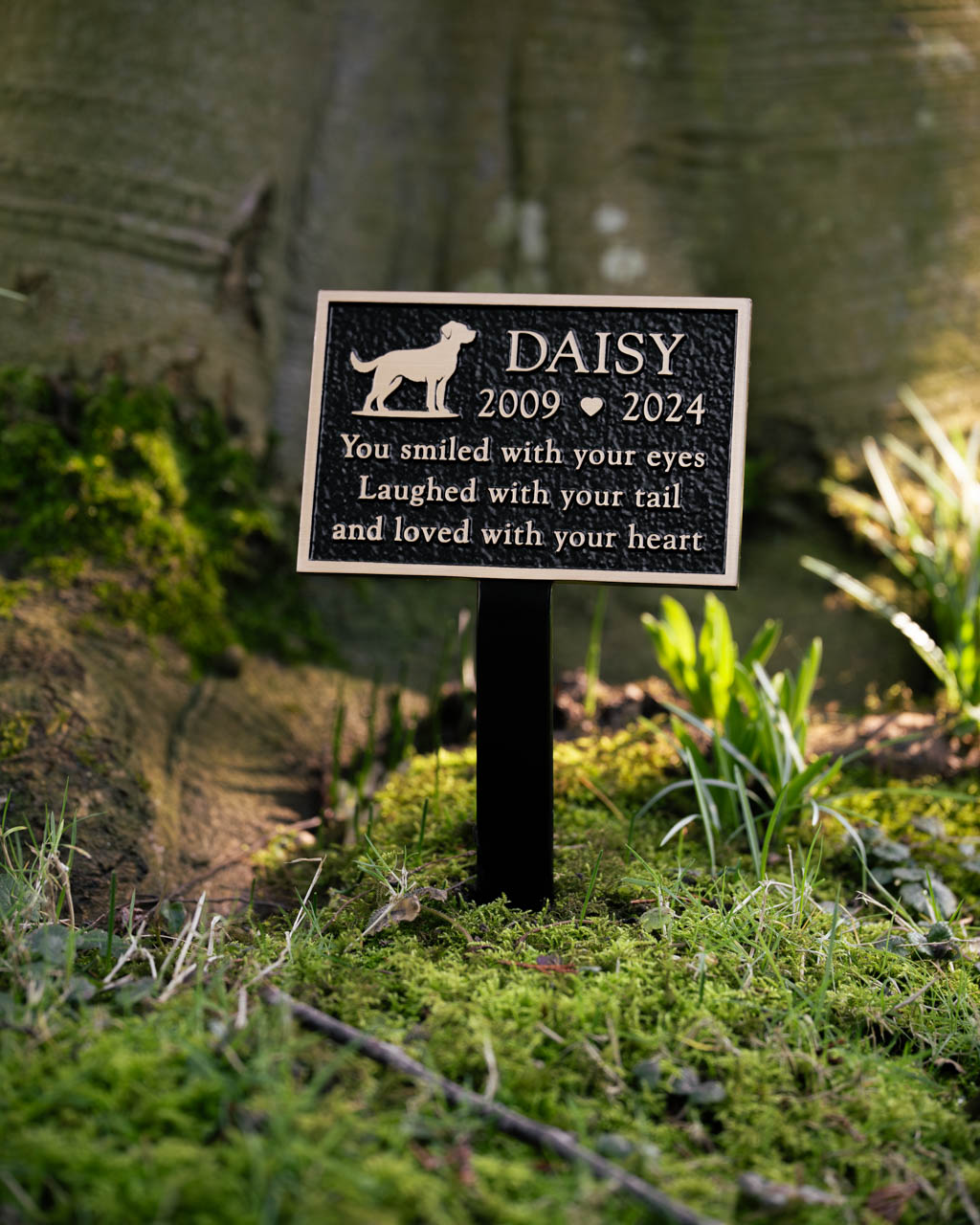 Cast bronze dog memorial plaque with a brown painted background, featuring an integral ground stake for secure outdoor placement. Customised with a raised dog motif and personalised inscription, this weather-resistant plaque offers a heartfelt tribute to a beloved pet. Designed for durability and elegance, perfect for gardens, pet cemeteries, or dedicated remembrance spaces.