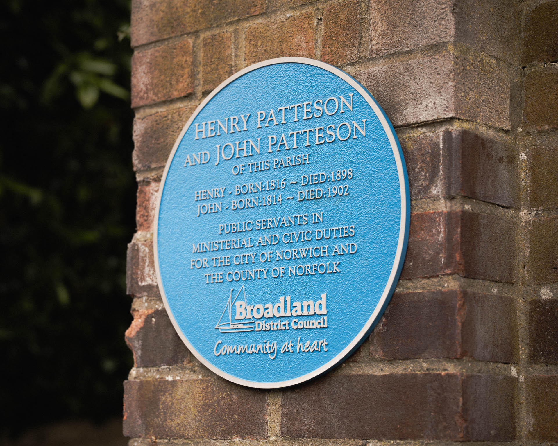 Handcrafted metal blue heritage plaques with elegant raised lettering, commemorating historical figures and events. Expertly made by Anglia Sign Casting.