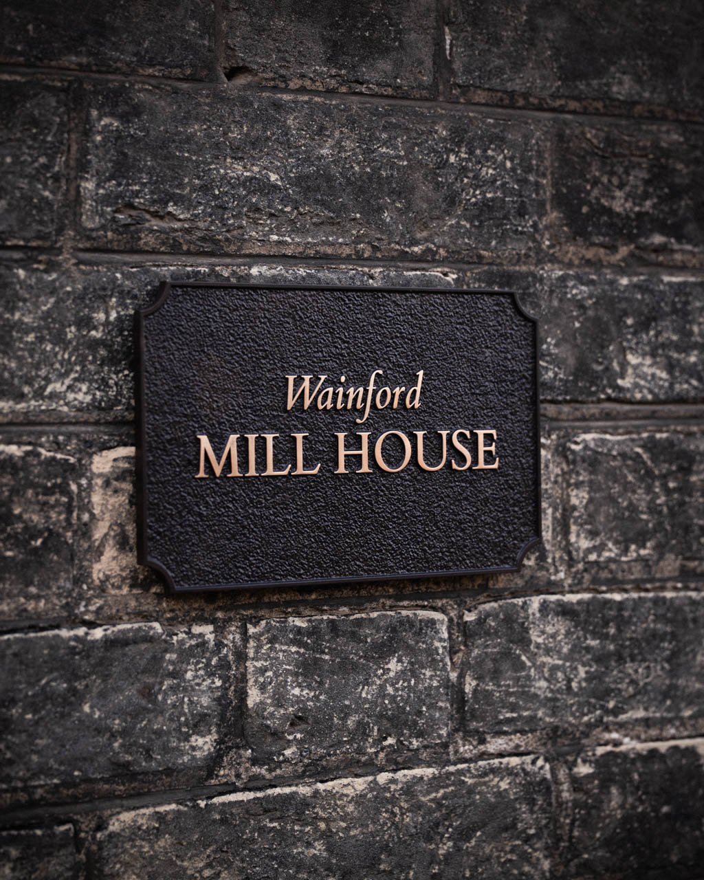 Elegant handcrafted house sign for Wainford Mill House, a charming Suffolk property. Expertly cast in metal for a timeless and refined look.
