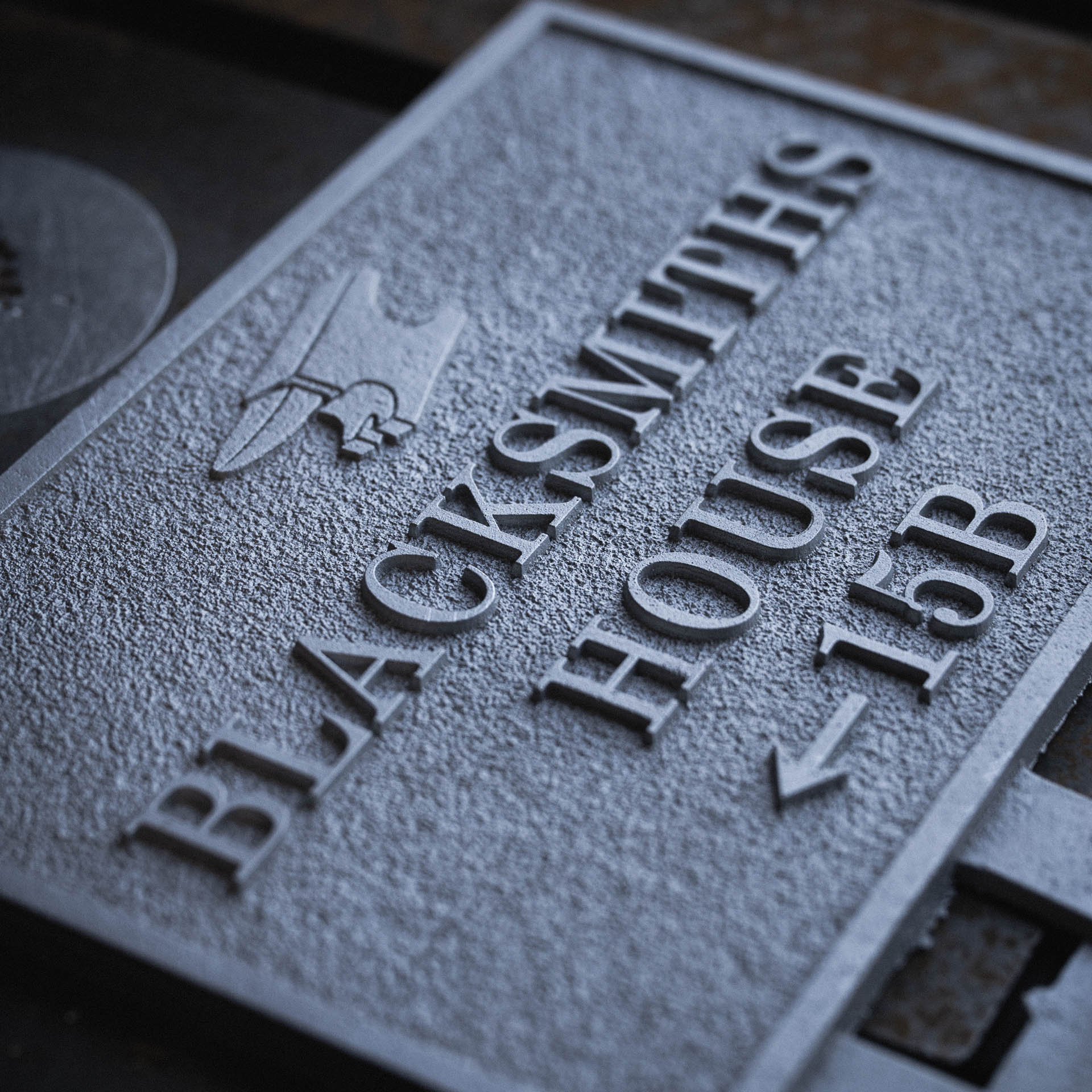 Unfinished cast aluminium plaque for Blacksmiths House before powder coating.