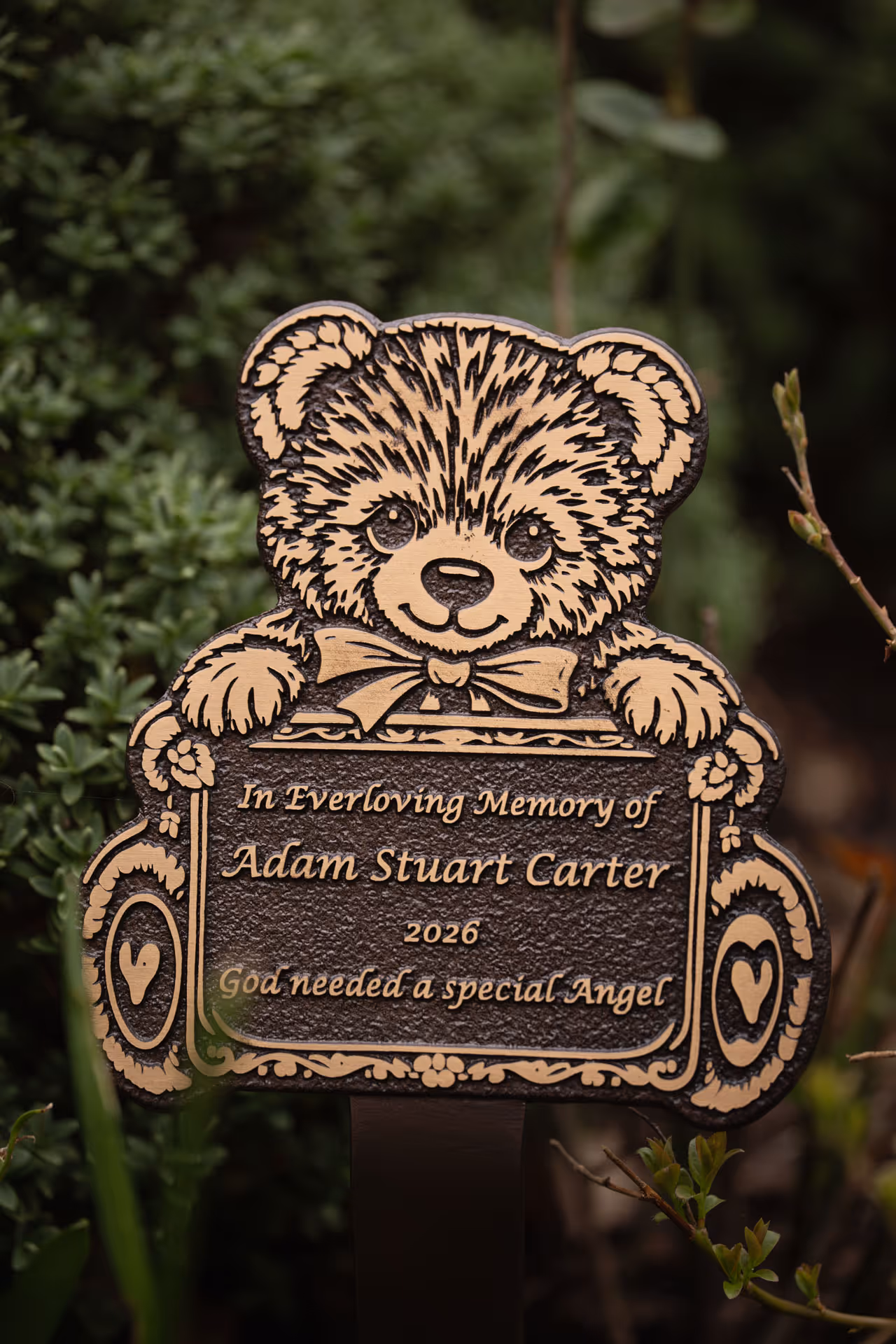 Children’s teddy bear memorial plaque mounted on a ground stake, suitable for graves or memorial gardens.