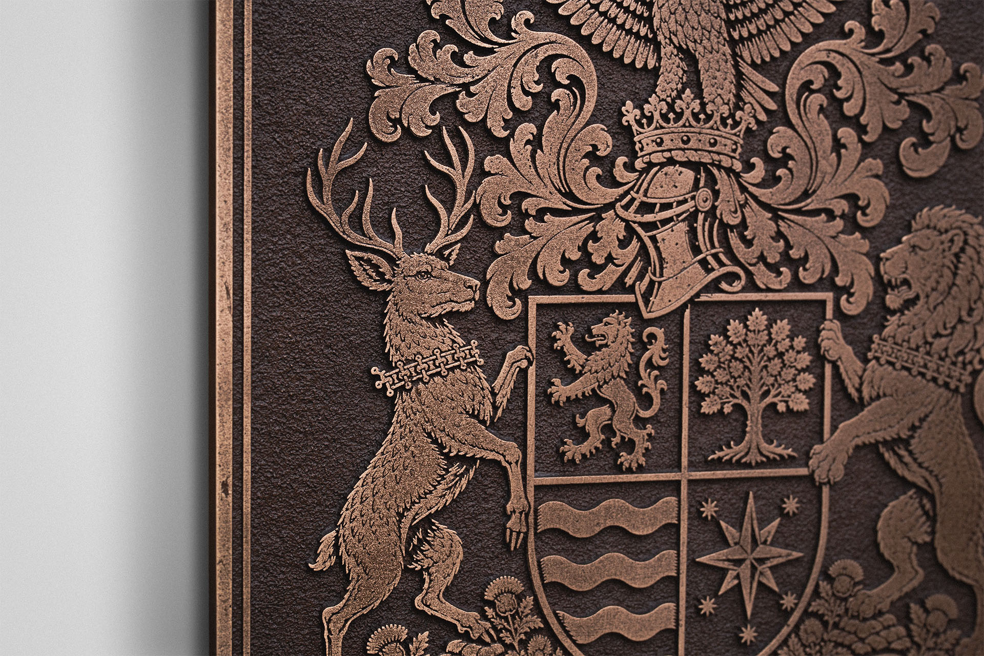Close-up of a detailed cast bronze coat of arms featuring a heraldic stag, shield and traditional decorative scrollwork.