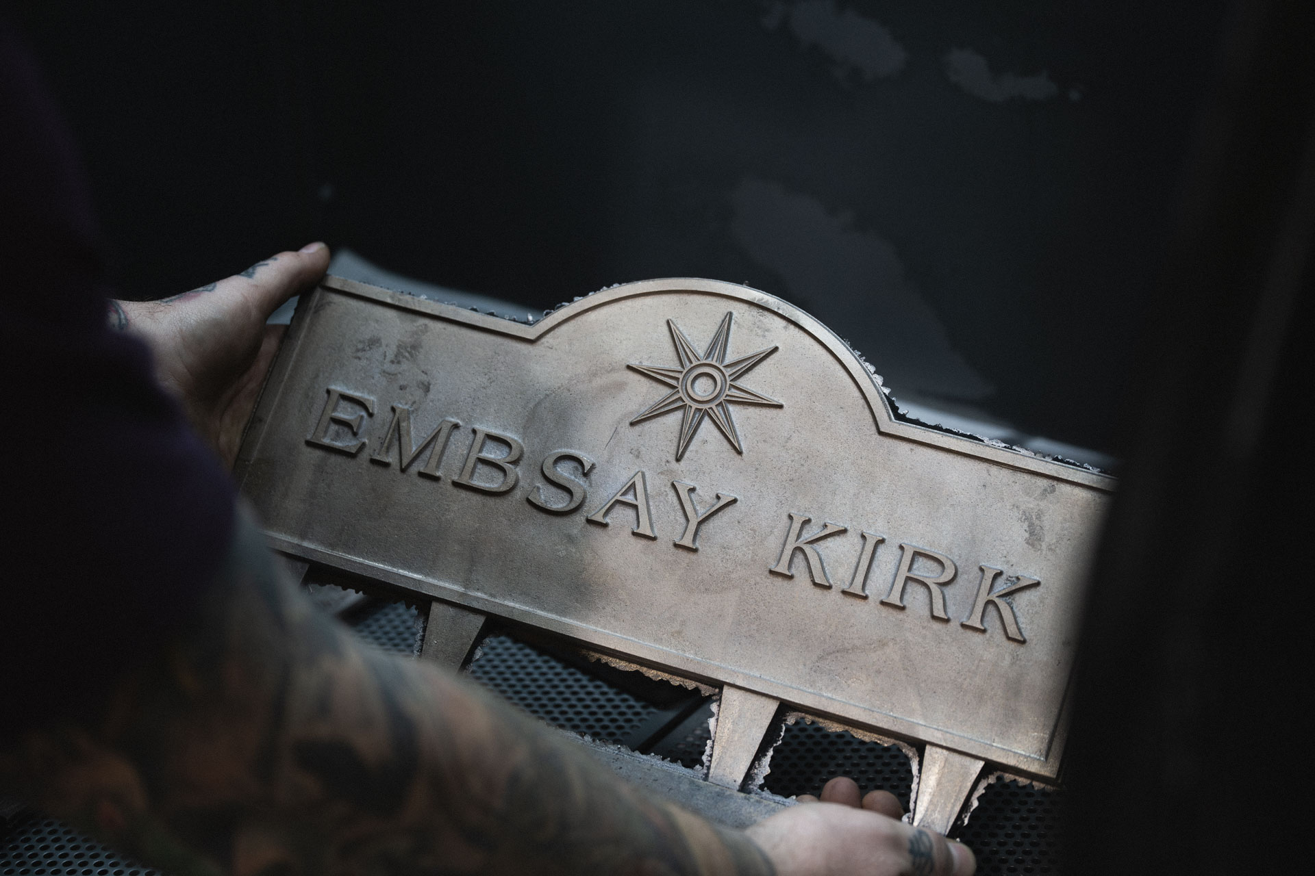Rough cast bronze house sign fresh from the mould, before fettling and hand-finishing in the workshop.