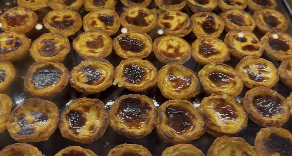 Tray of freshly baked pastéis de nata — Portugal's most iconic pastry