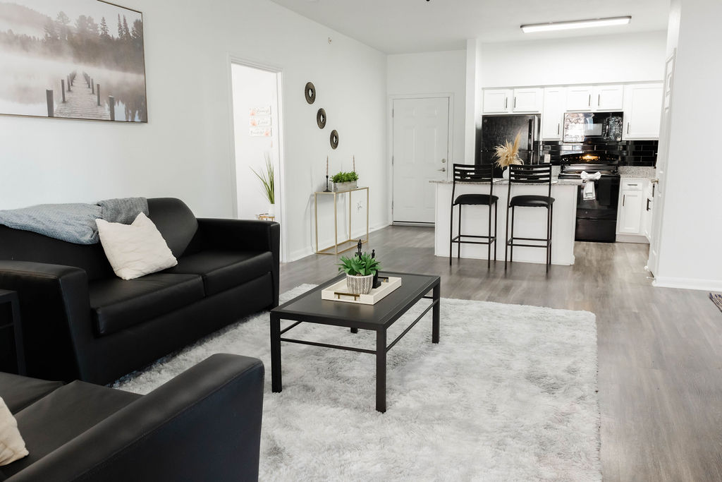 Living room with furniture and kitchn
