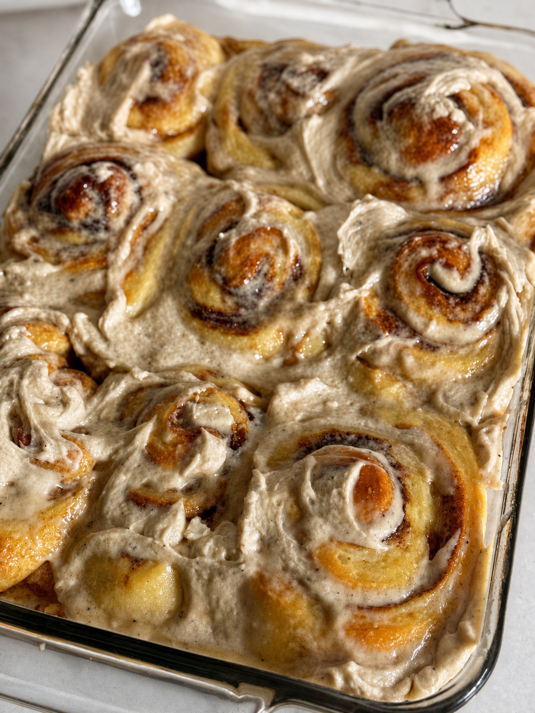 Freshly baked sourdough cinnamon rolls with brown butter cream cheese frosting