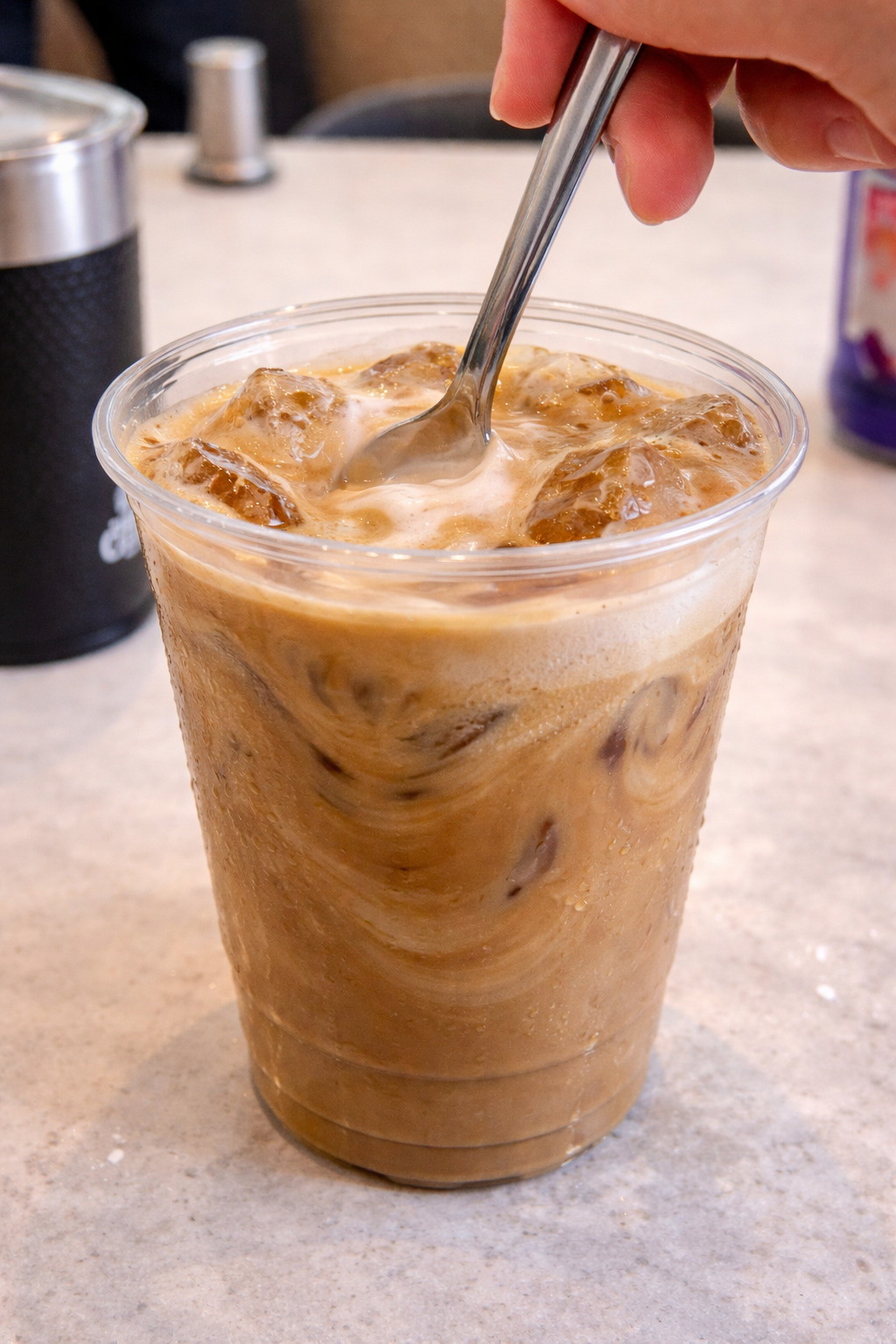 stirring the ice latte