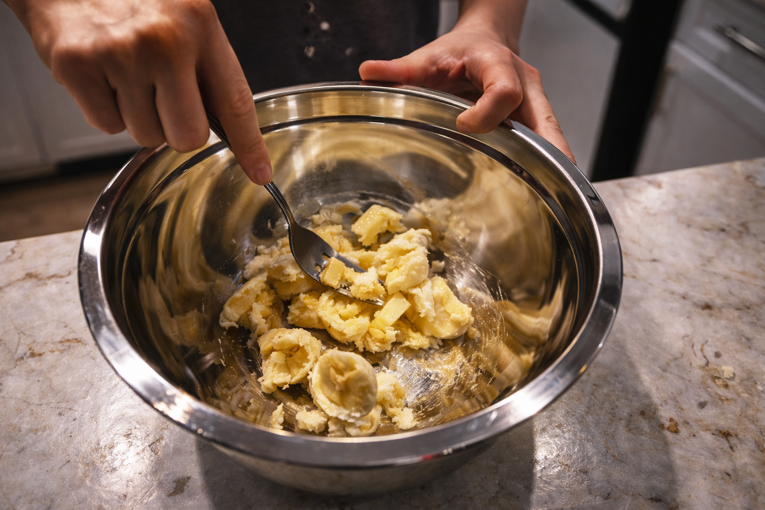 mashing banana in a bowl