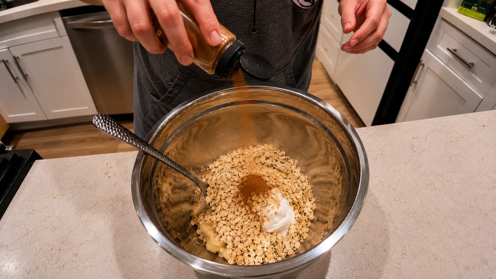 cinnamon in muffin mixture in bowl