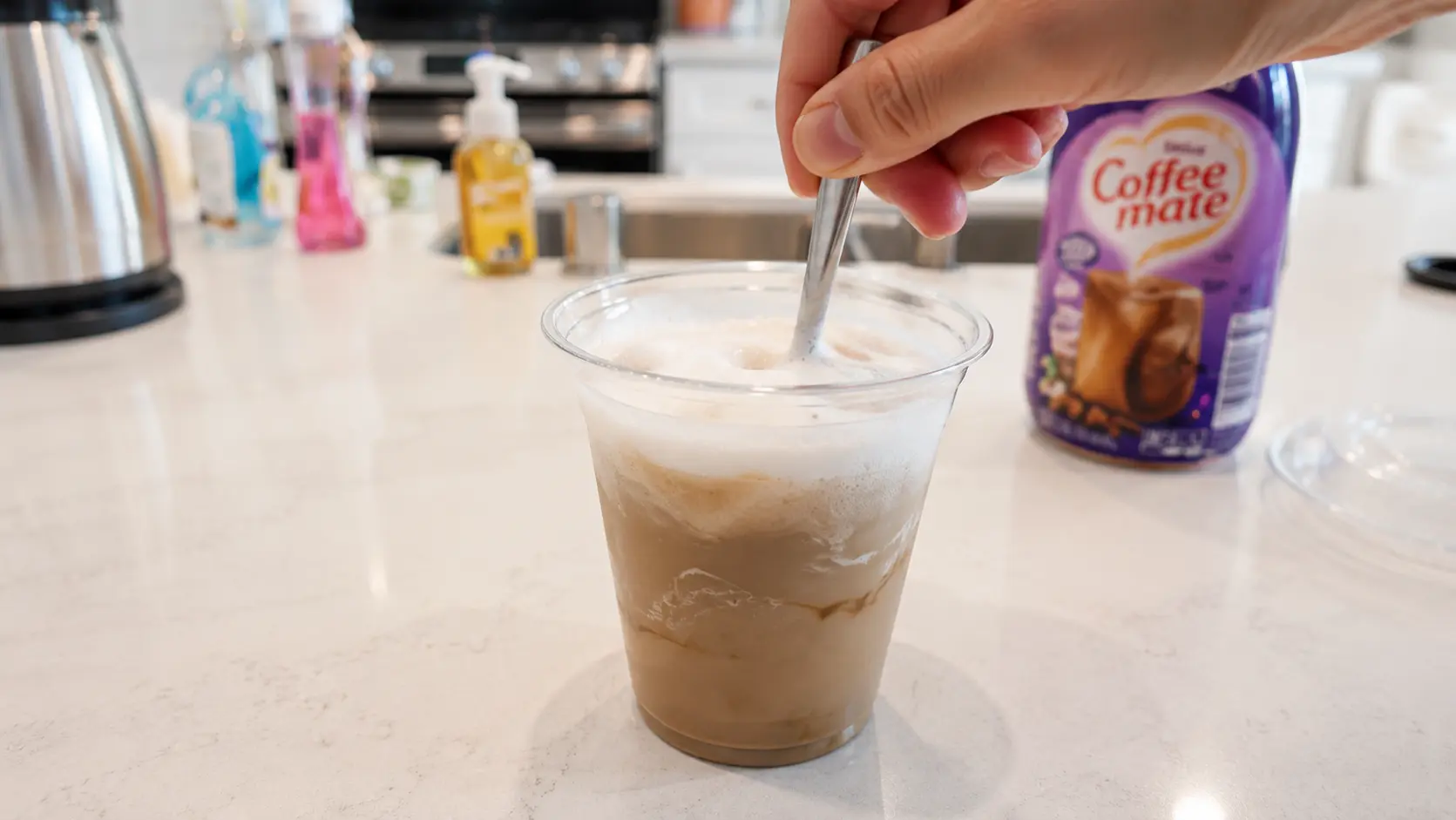 stirring the ice latte