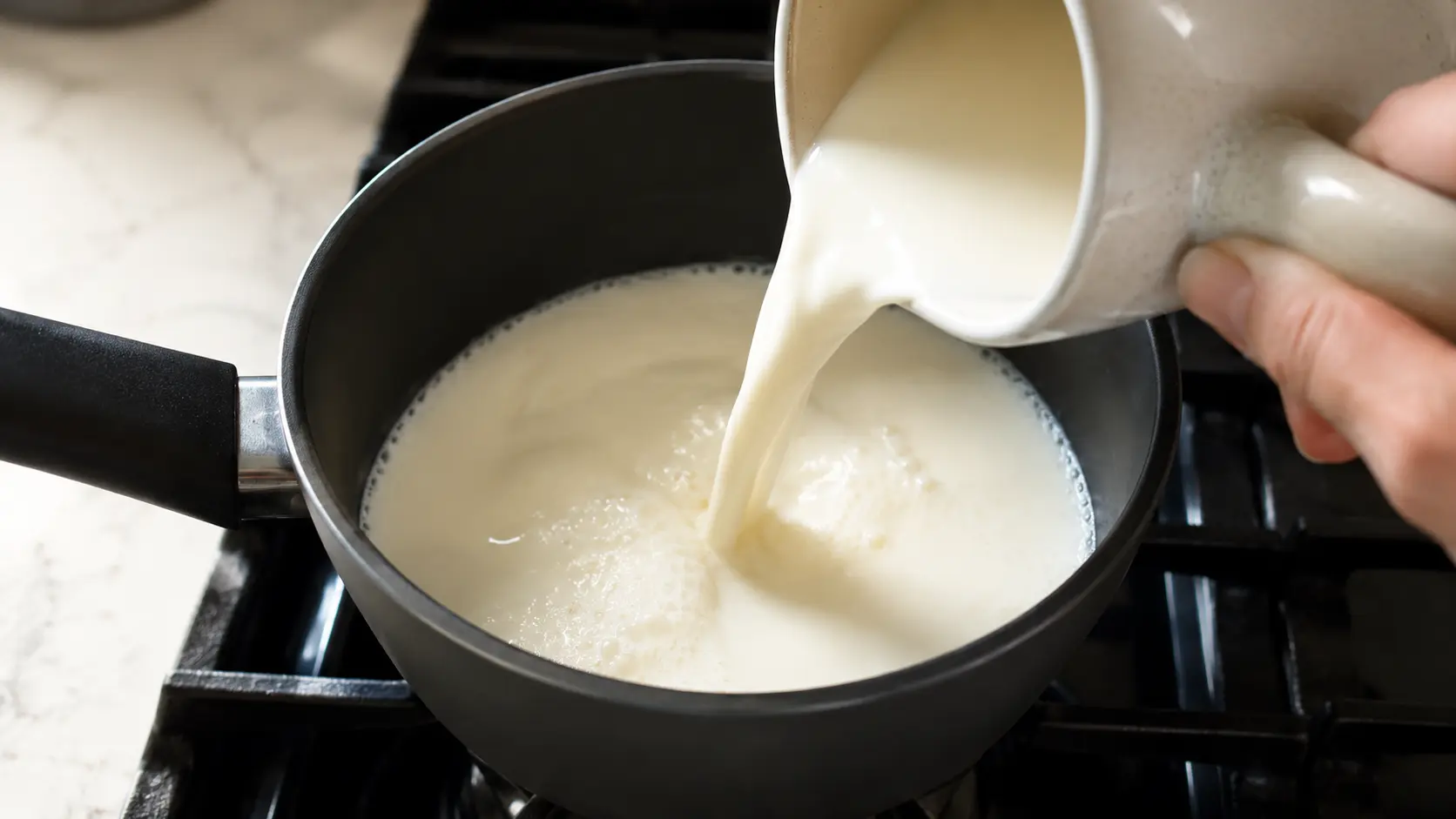 Milk being poured into a saucepan on the stovetop to make creamy homemade protein oatmeal.