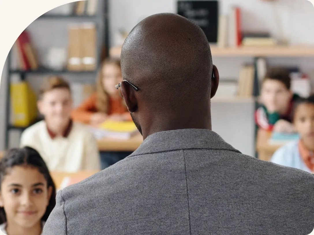 A teacher facing a classroom full of students