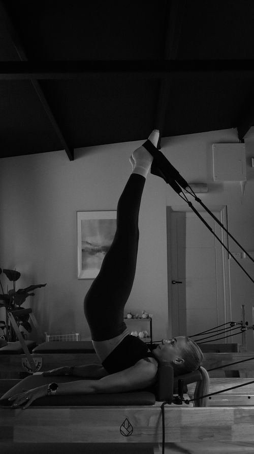 Sam performing Reformer Pilates movements