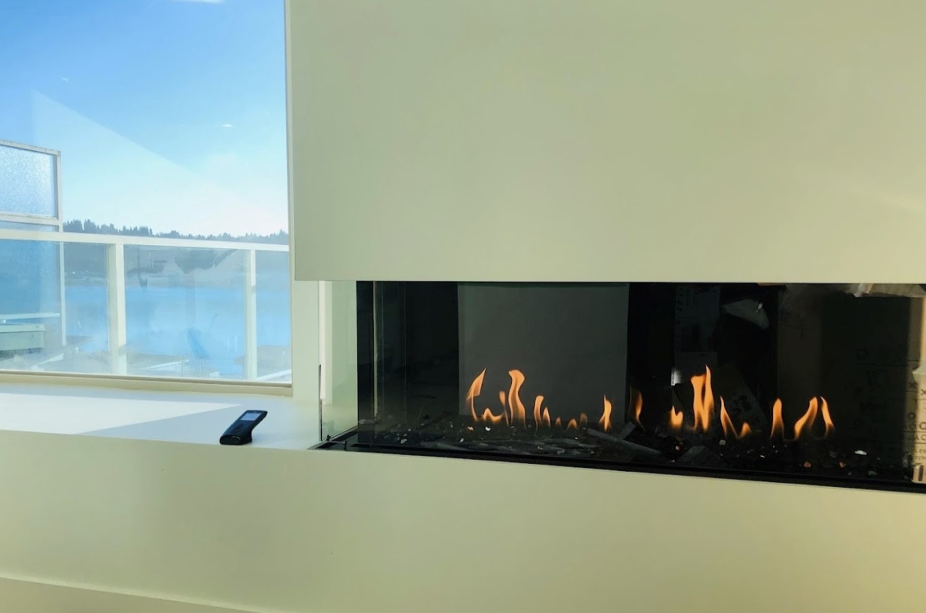 Modern gas fireplace insert burning cleanly in a living room
