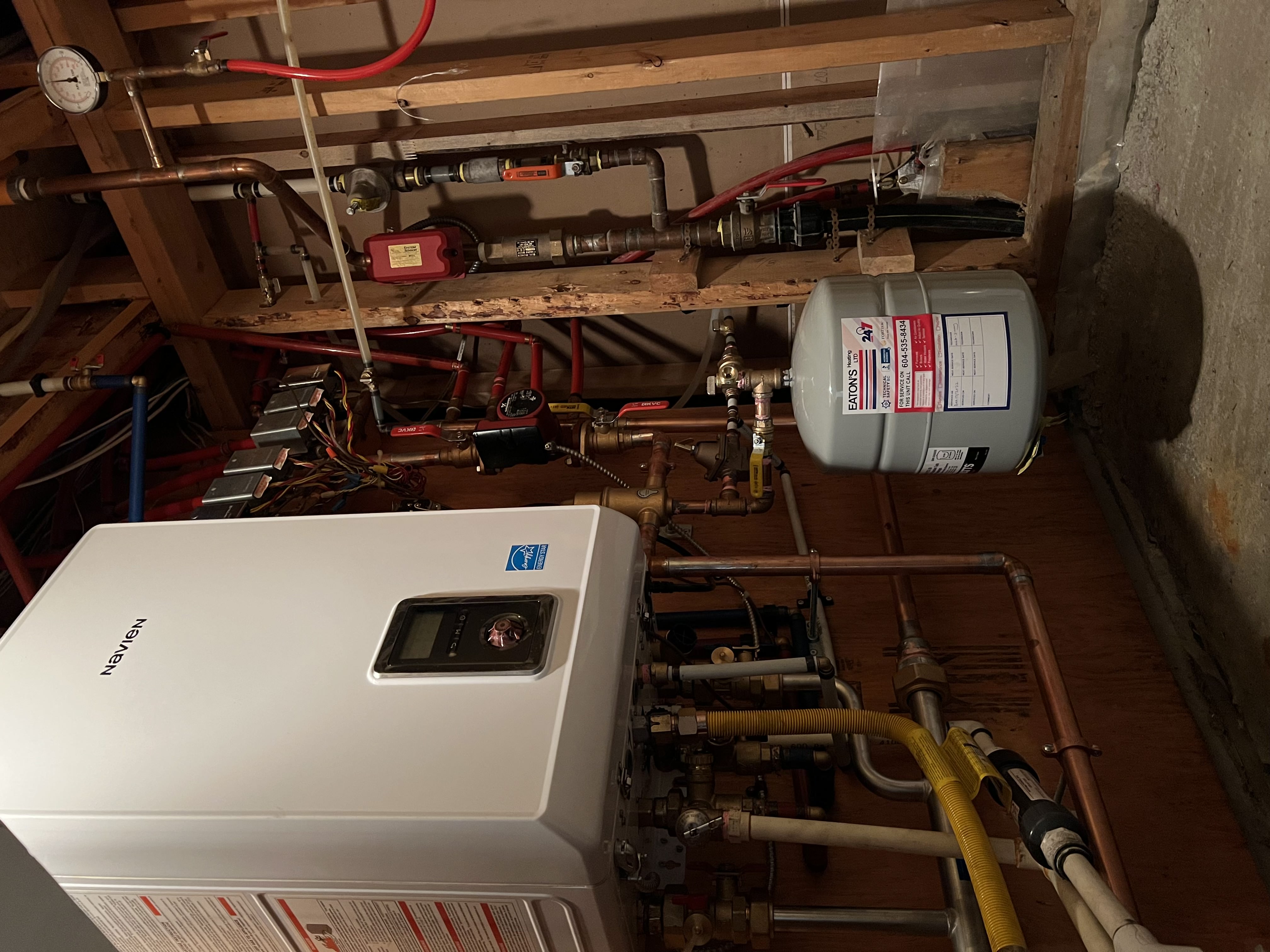 Residential combi boiler installed in a home utility room