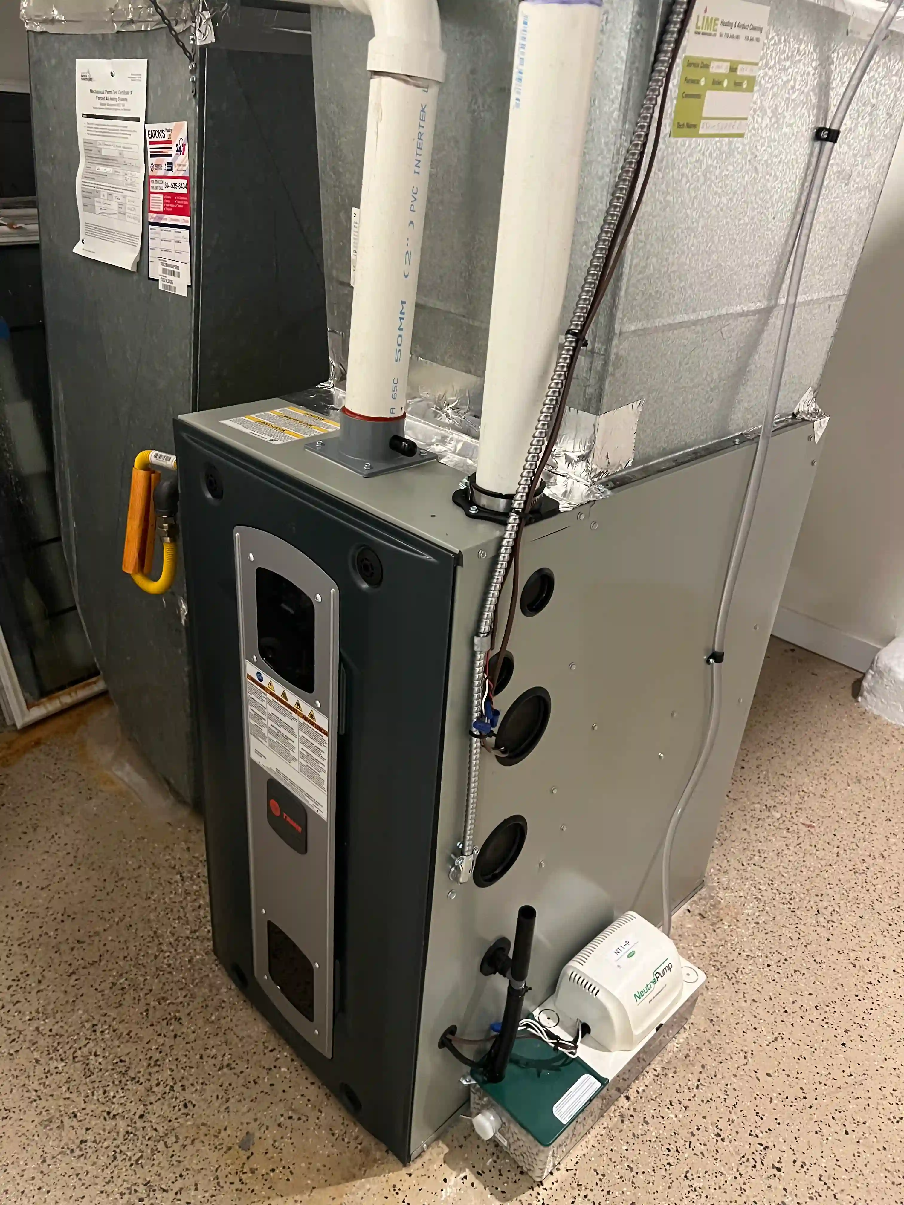 Open gas furnace panel showing internal components during diagnostic service