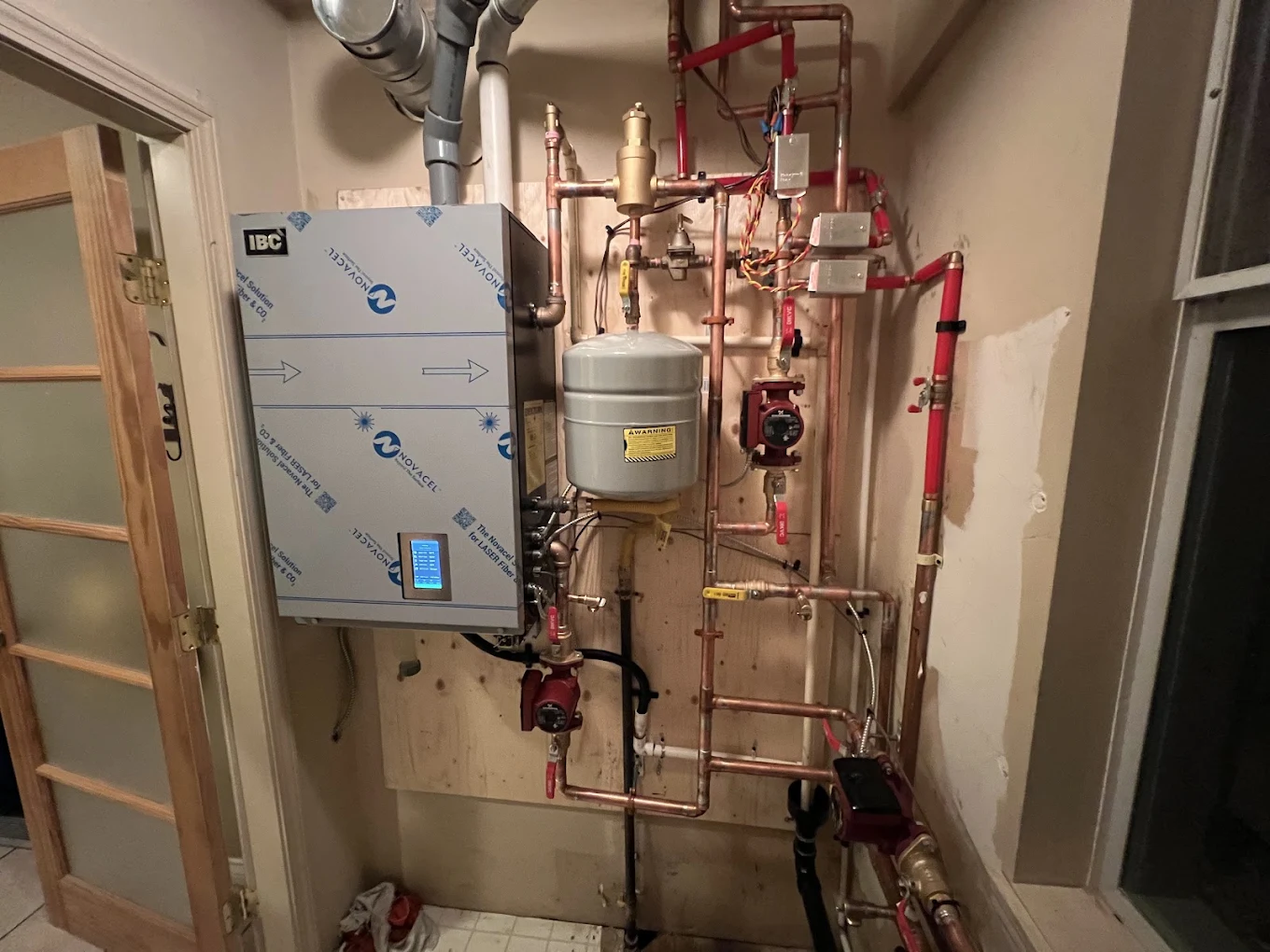 Hydronic boiler system with piping and expansion tank during diagnostic service