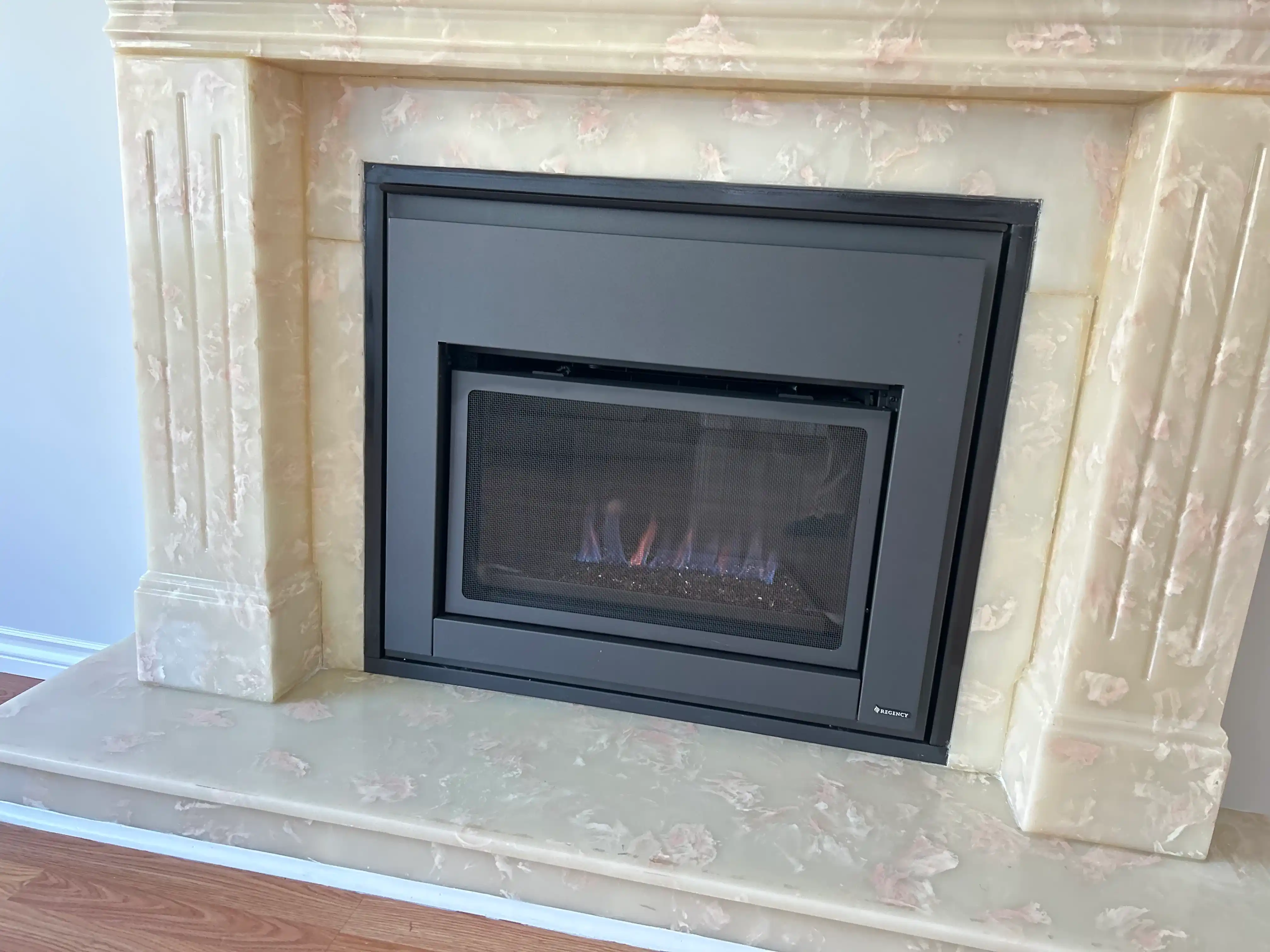 New gas fireplace insert being installed in a Burnaby home