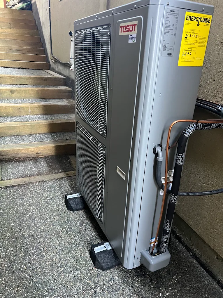 Heat pump outdoor unit being diagnosed during a repair service call in Burnaby