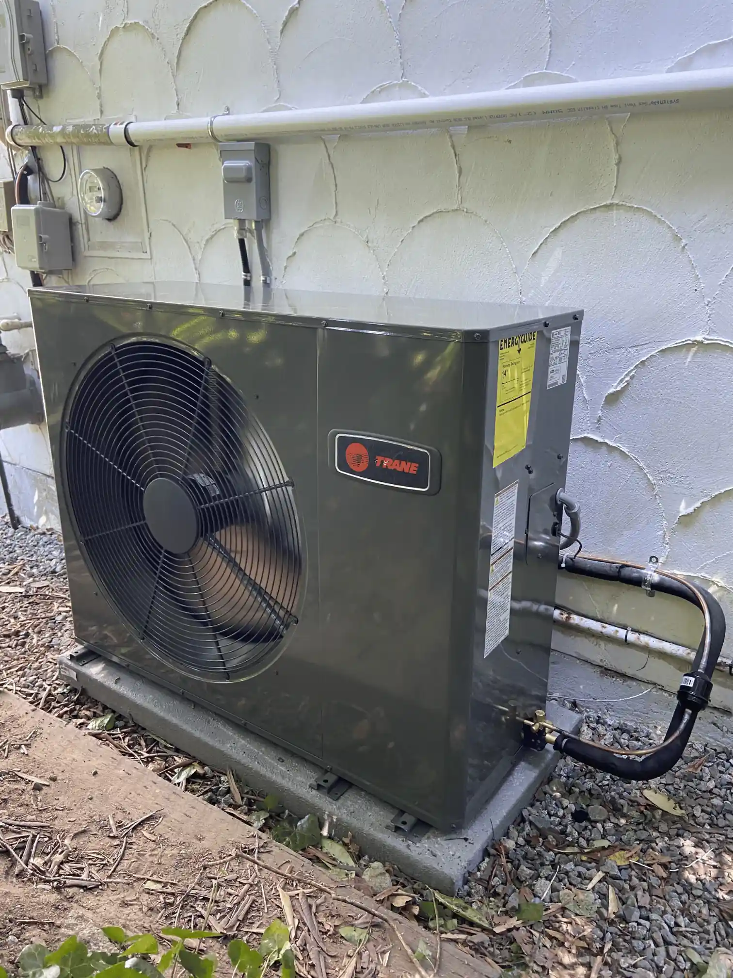 New heat pump outdoor unit installed beside a Burnaby residential home