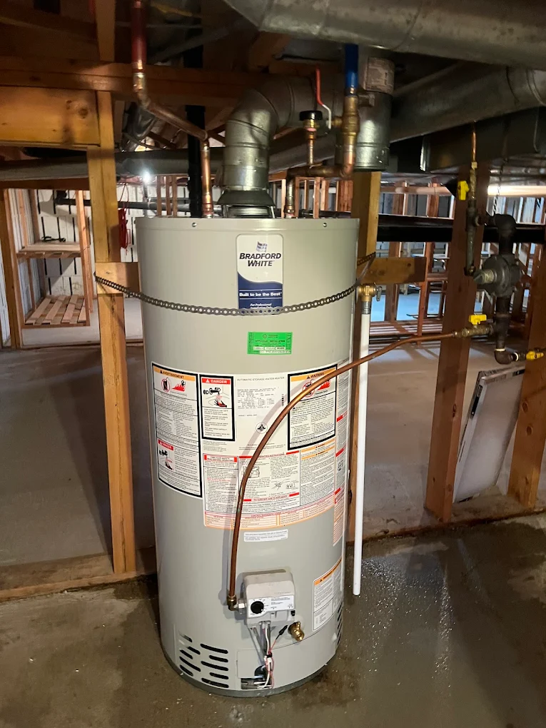 Hot water tank replacement with new tank being connected in a residential utility room