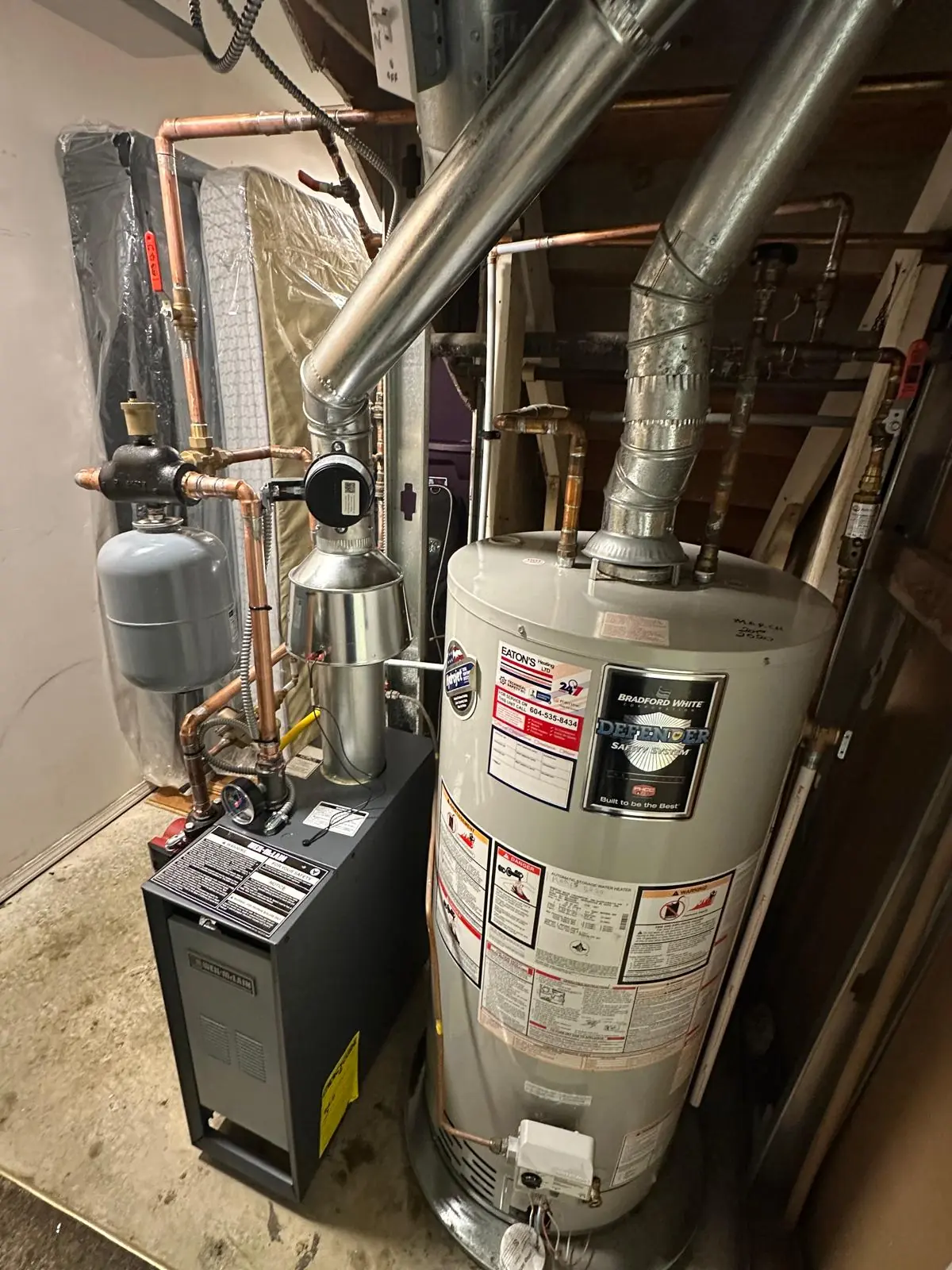 New hot water tank installed with proper gas and water connections