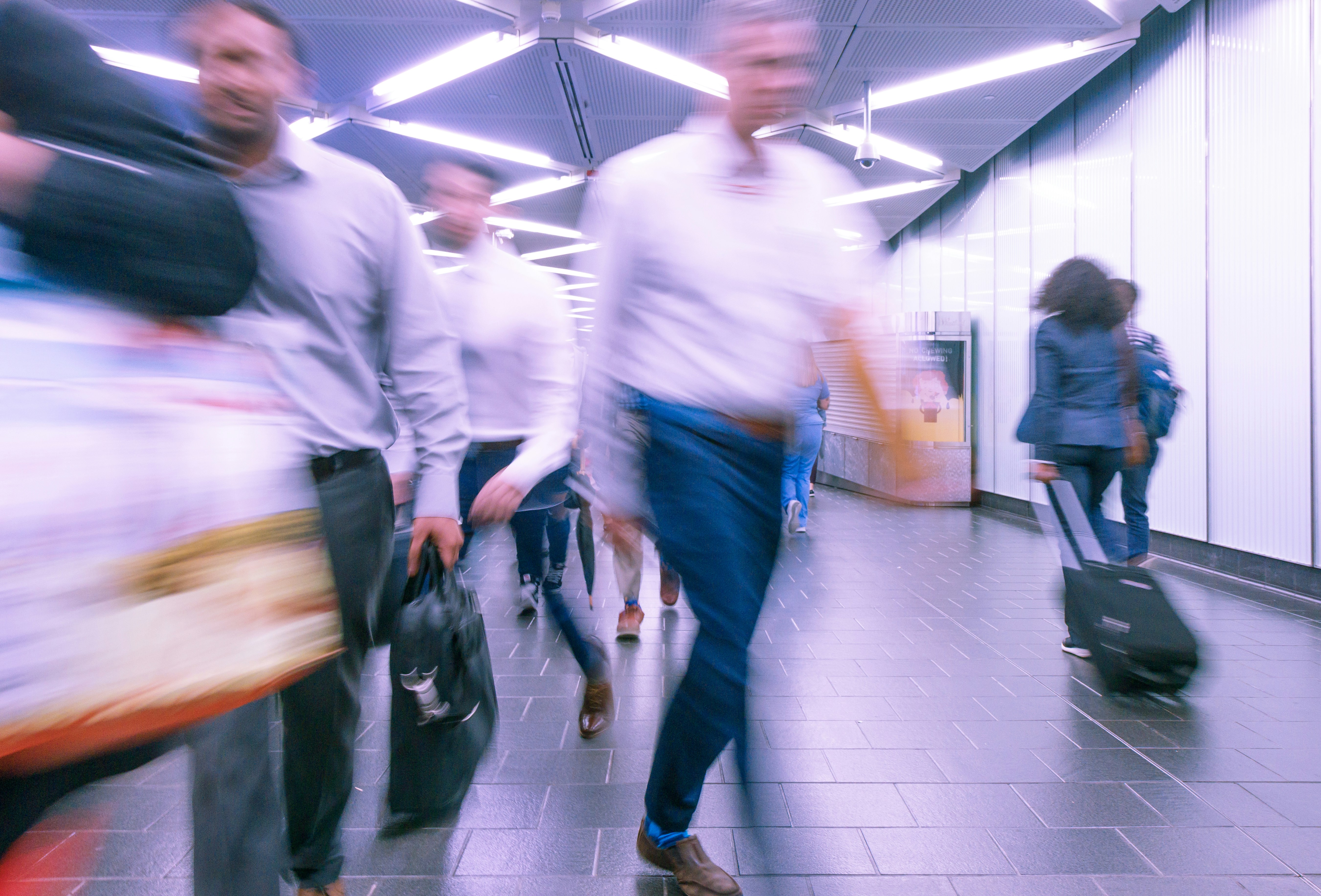 Blurred shot of people walking through a corridor