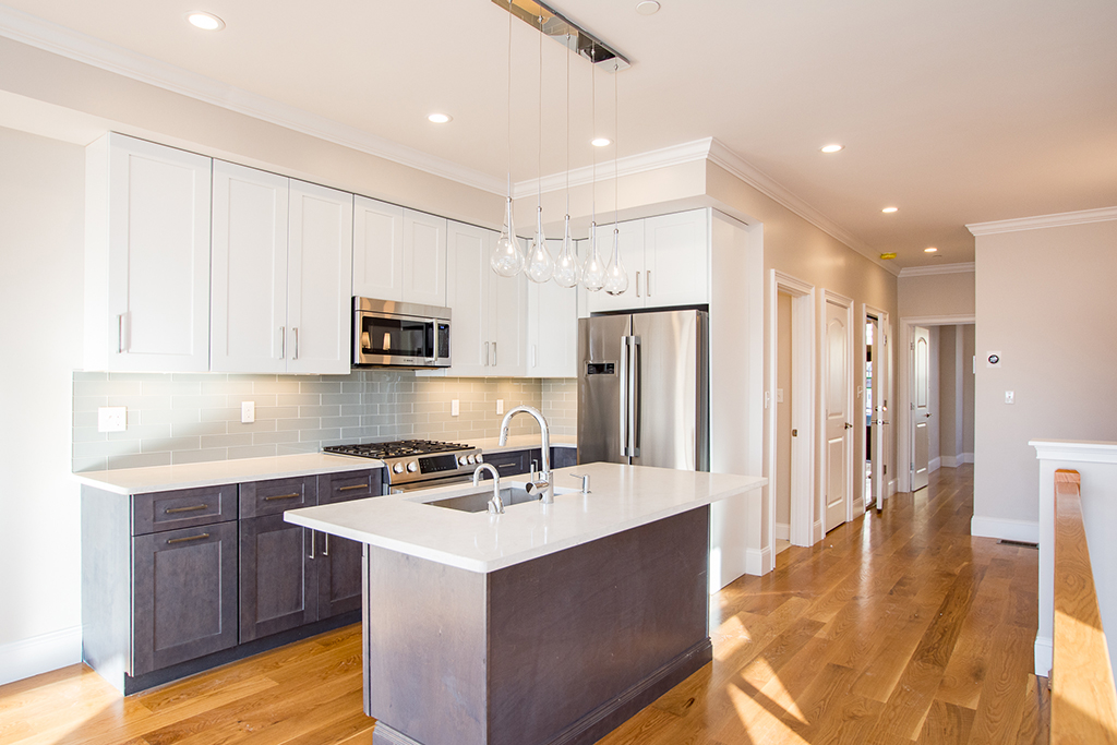 Conversion into three condo units with water views in east Boston.