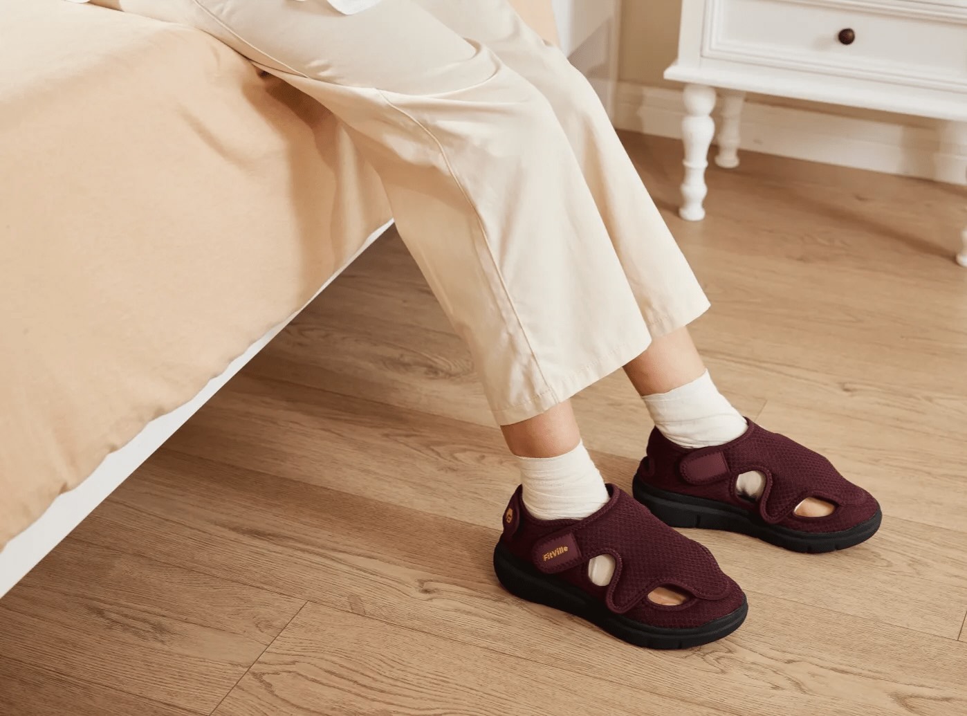 A diabetic person wearing orthopedic shoes for her foot comfort as she suffers from diabetic neuropathy.