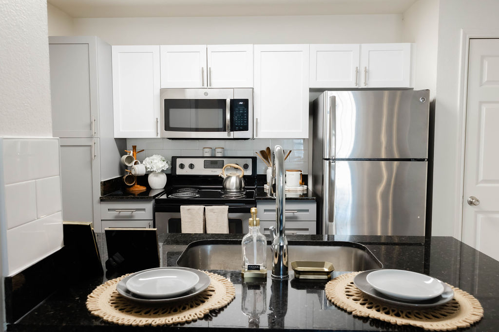 Staged kitchen with stainless steel appliances