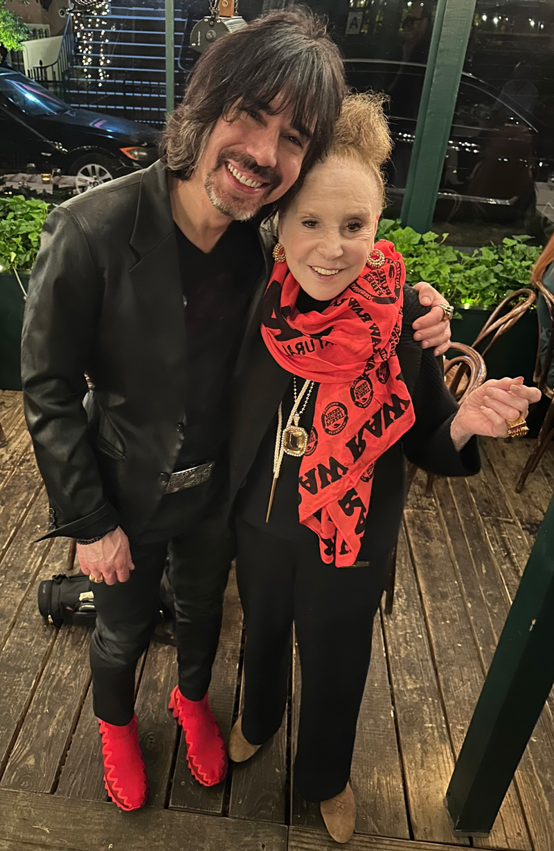 Josh Kesselman stands with ASPCA's Cindy Adams