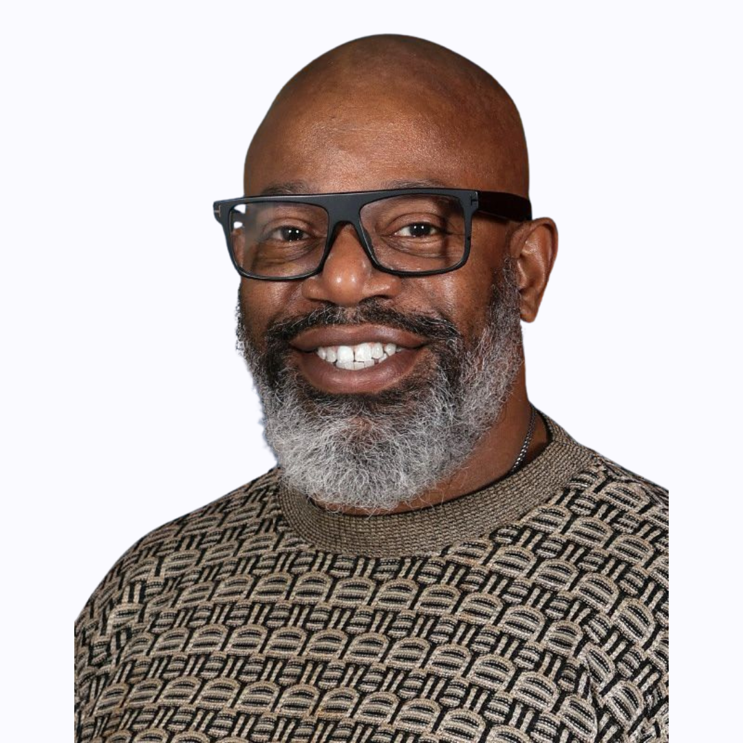 Professional headshot of staff member with glasses