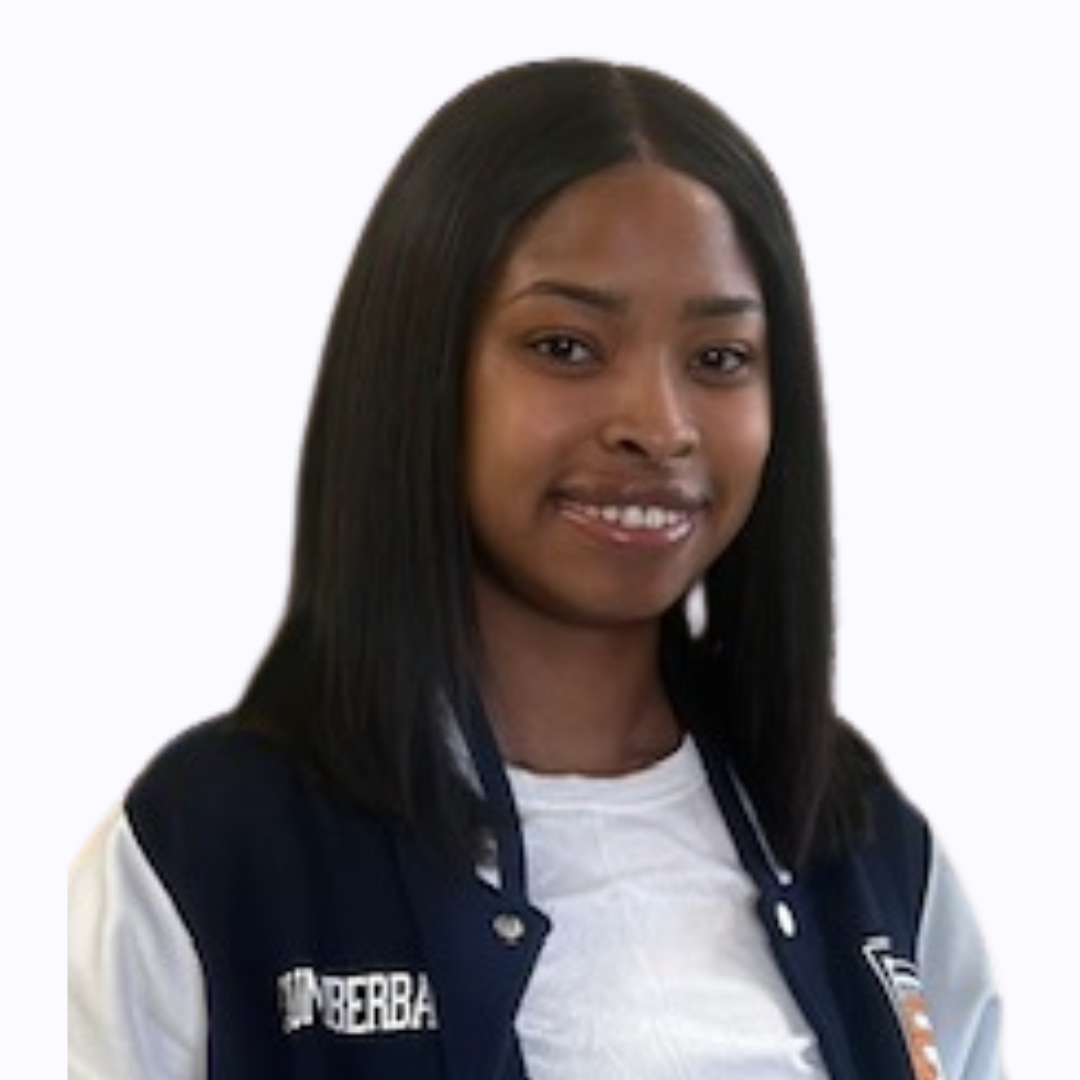 Student wearing navy and white varsity jacket
