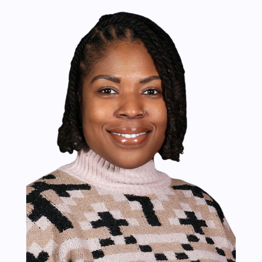 Ms. Vilbrun smiling in a professional staff headshot photo