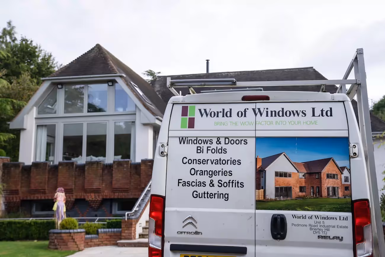 World of windows van outside of a modern home with newly fitted open plan windows