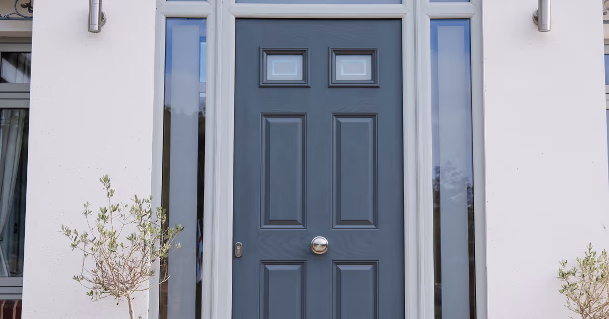 Grey door on modern white house