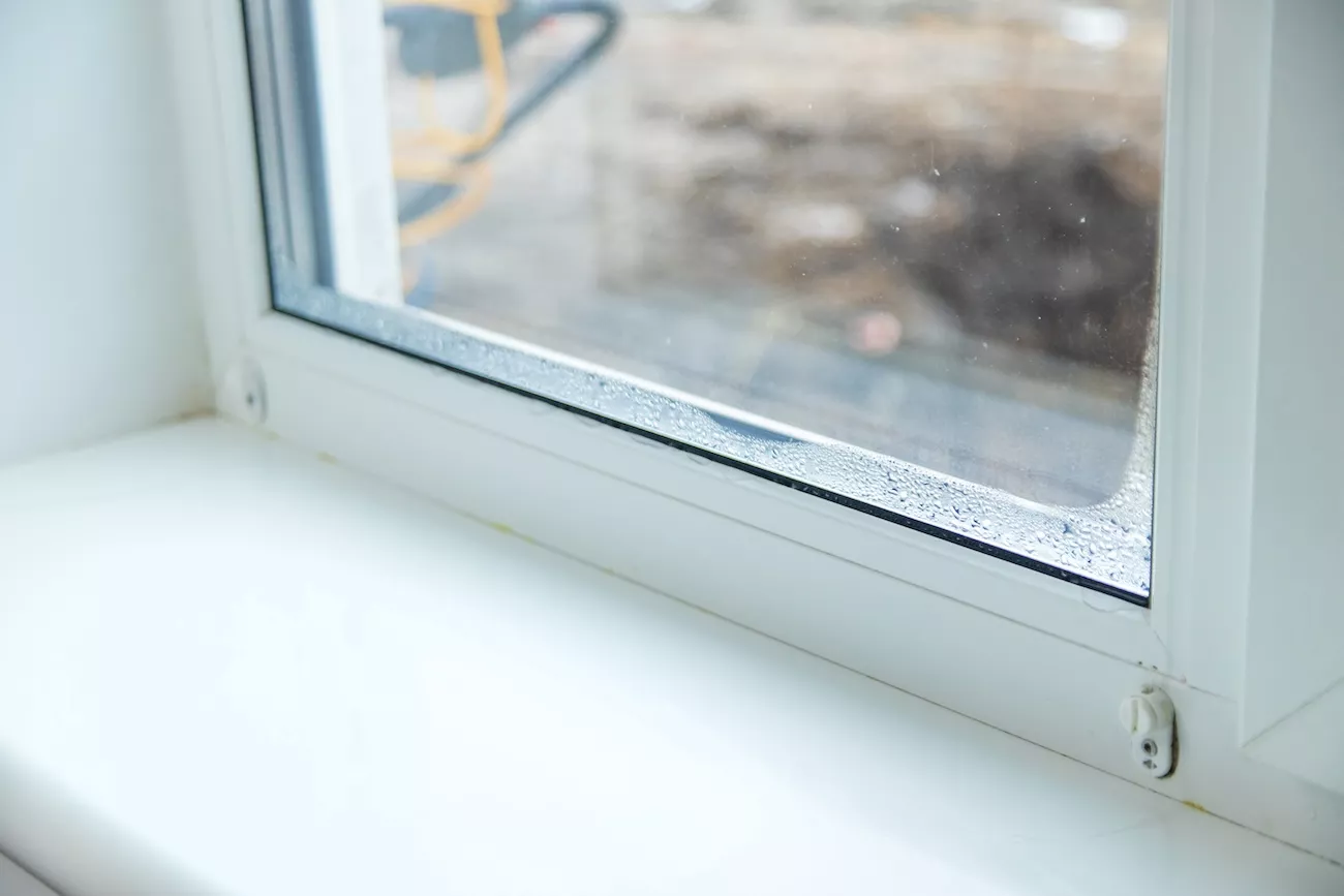 Moisture in a double-glazed window unit. 