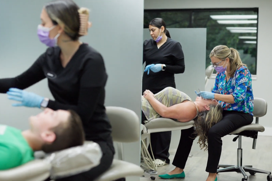Orthodontic patients receiving care from the team at Marks Orthodontics in Norton Shores, Michigan.