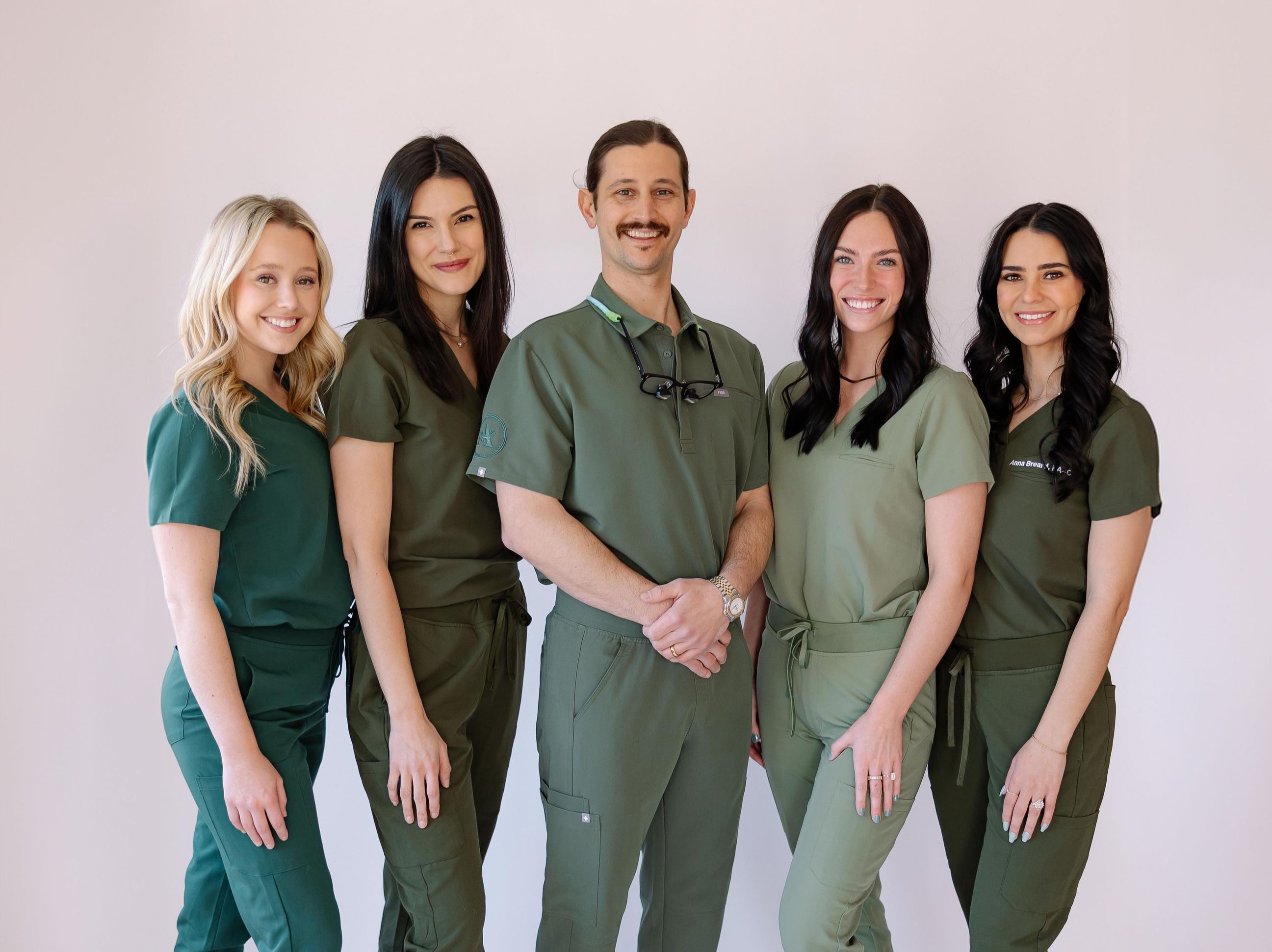 Dr Barron Heymann posing with surgical staff
