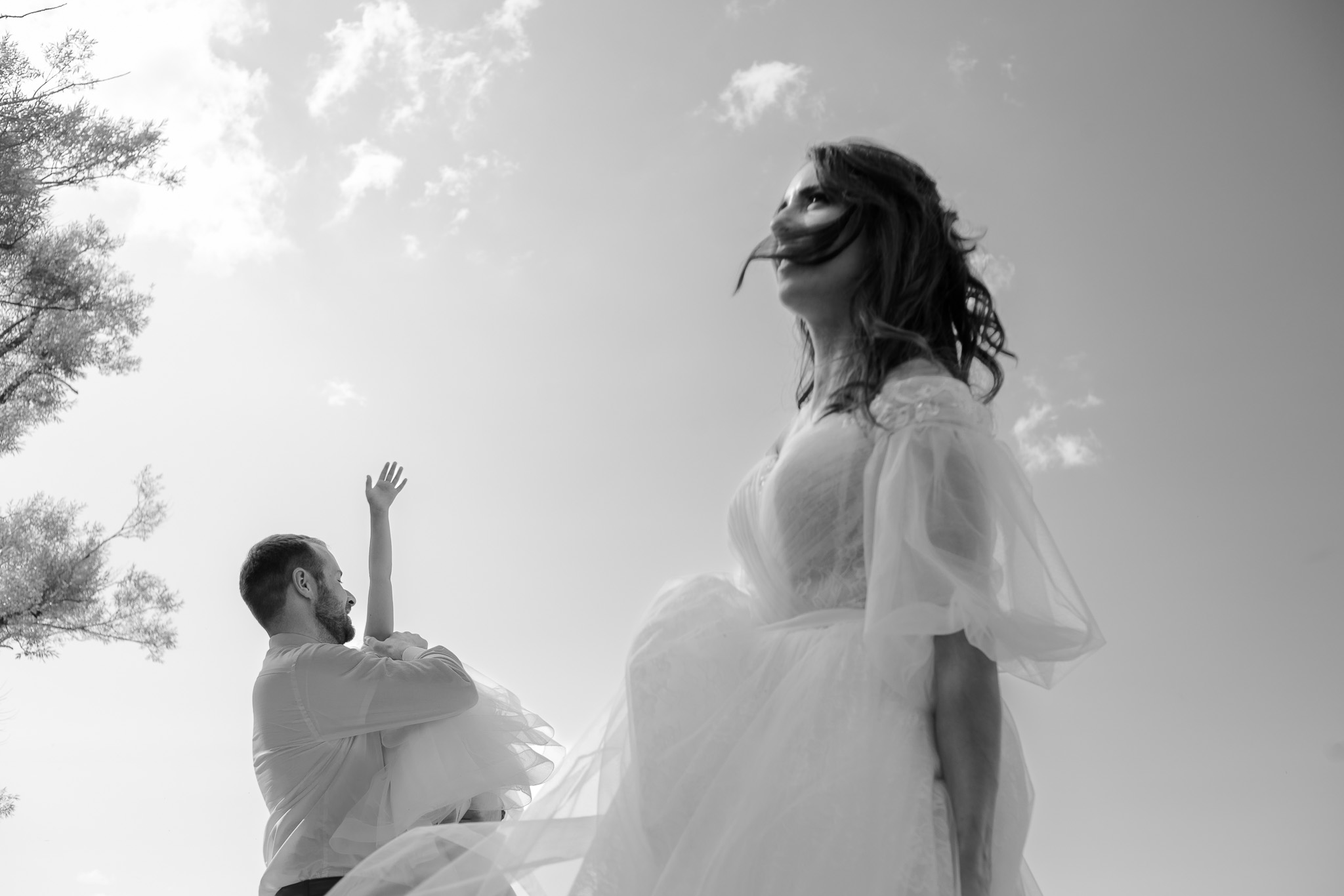 Husband and wife standing across each other.