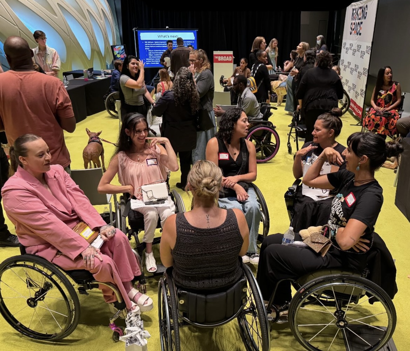 A group of 4 disabled people posing for a photo