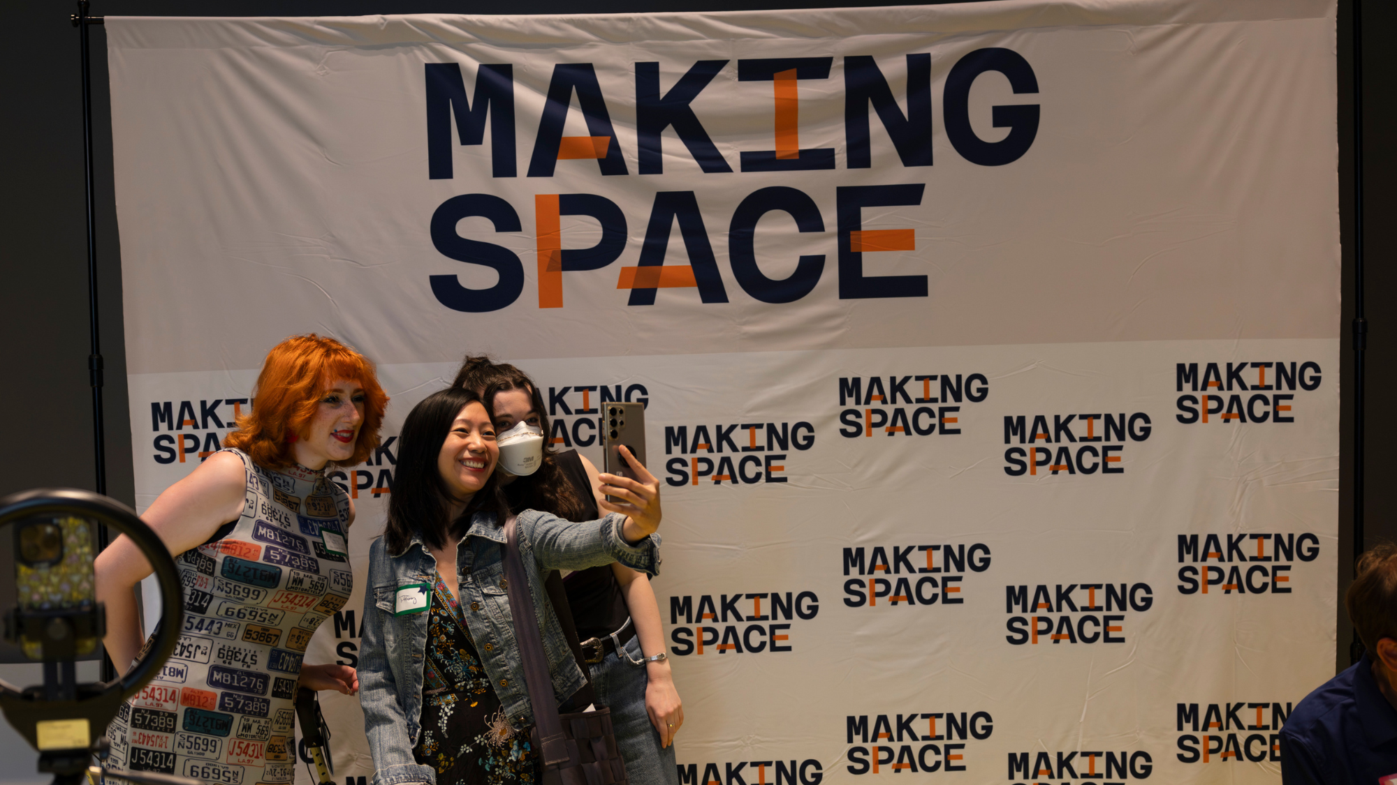 Picture taken by Salvador Ceja Garcia of Making Space community and staff taking a selfie against a Making Space step and repeat.