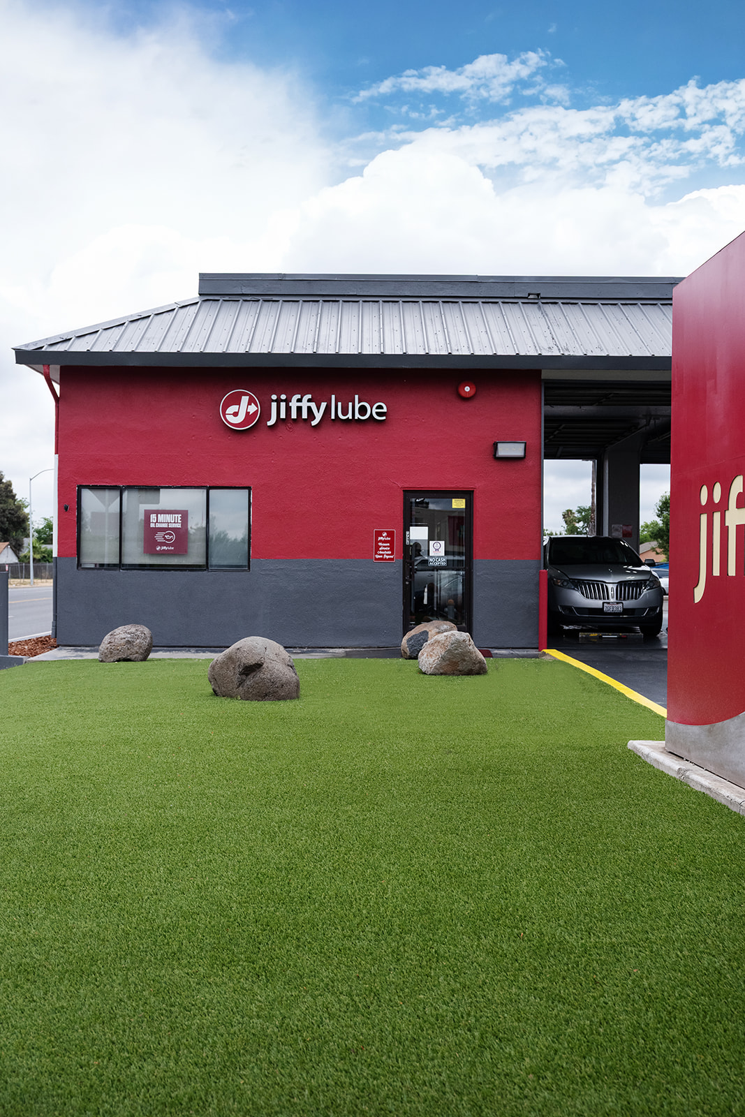 Total Turf commercial artificial turf installation at a Sacramento Jiffy Lube